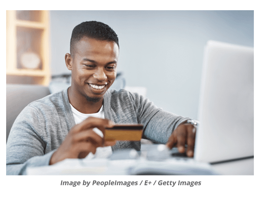 Man making online order using credit card.