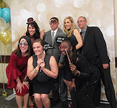 Gen enjoying the photo booth at Computrition's 40th anniversary with her ARM team.