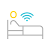 A multicolored icon of a hospital patient in bed with signal waves.